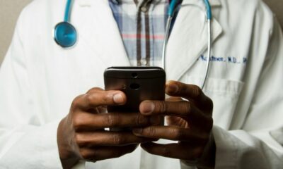 Doctor using an app on a smartphone device as healthcare regulator MHRA is fast-tracking new AI tools that promise to dramatically improve patient care.
