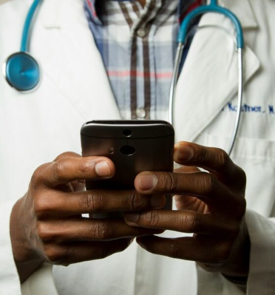 Doctor using an app on a smartphone device as healthcare regulator MHRA is fast-tracking new AI tools that promise to dramatically improve patient care.