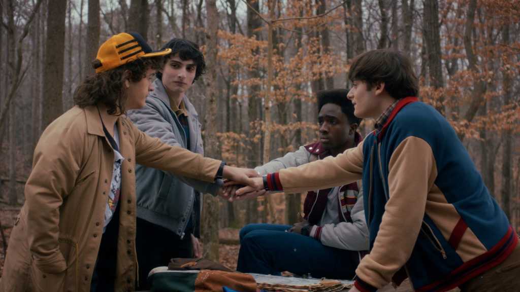 STRANGER THINGS. Gaten Matarazzo as Dustin Henderson, Finn Wolfhard as Mike Wheeler, Caleb McLaughlin as Lucas Sinclair, and Noah Schnapp as Will Byers