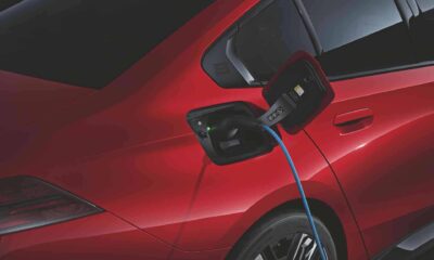 BMW i5 showing a charging cable