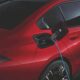 BMW i5 showing a charging cable