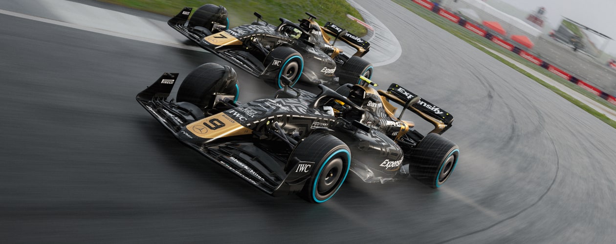 F1 25 – F1 The Movie DLC header – APXGP team cars driving rounding a race track