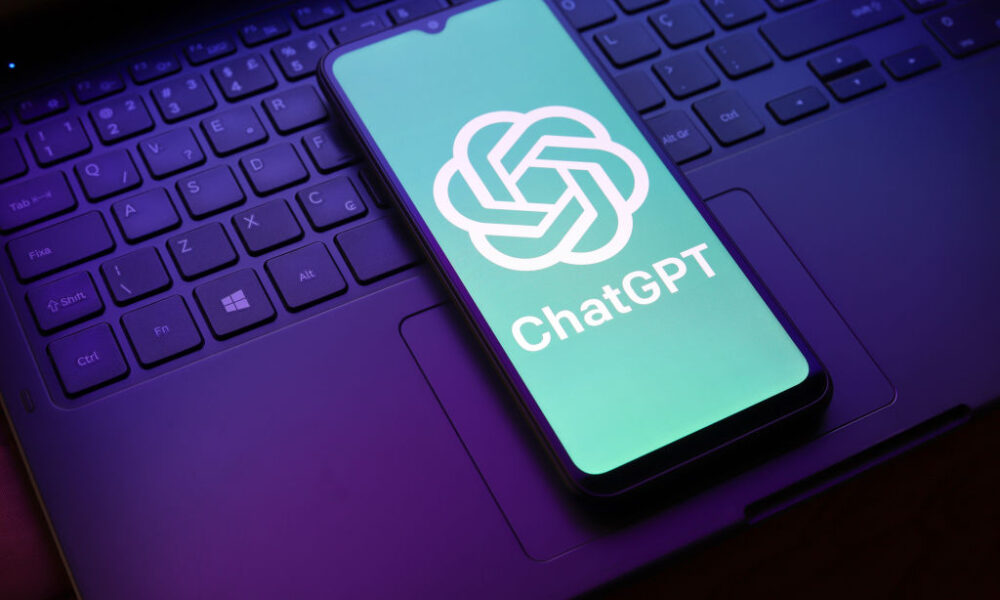 The ChatGPT logo appears on a smartphone screen