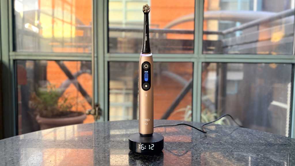 Oral-B iO Series 10 Special Edition electric toothbrush standing on its charging base