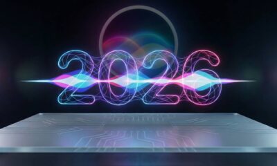 A futuristic concept image showing glowing neon digits for the year "2026" with an integrated waveform, standing out against a darkened circular Apple Siri logo in the background, all resting on a circuit board platform.