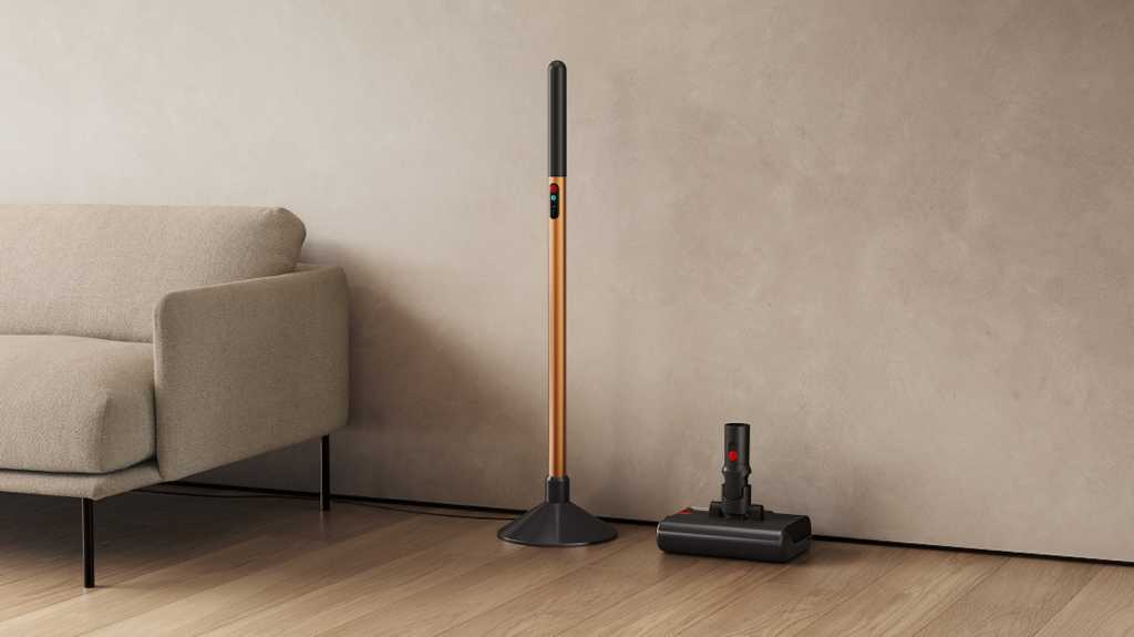 Dyson PencilWash standing against a wall