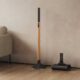 Dyson PencilWash standing against a wall