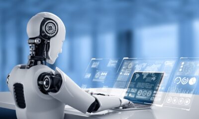 Robot humanoid uses laptop