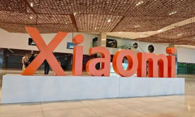 The Xiaomi logo in a large orange sculpture