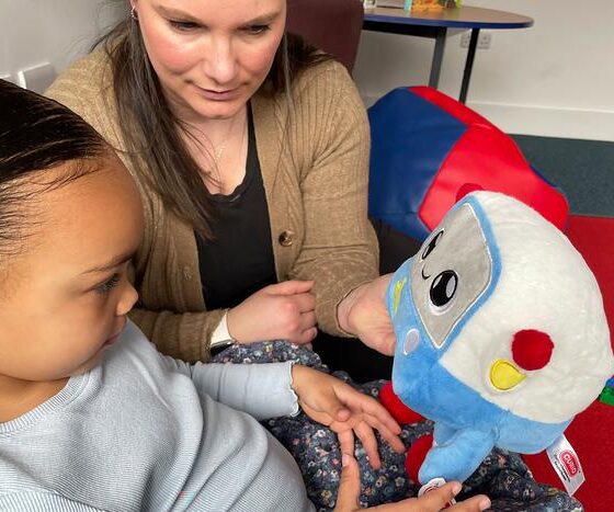 Mya, age 3, and her mum, Vicky, playing with the AI toy, Gabbo, during an observation at the University of Cambridge’s Faculty of Education.