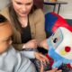 Mya, age 3, and her mum, Vicky, playing with the AI toy, Gabbo, during an observation at the University of Cambridge’s Faculty of Education.