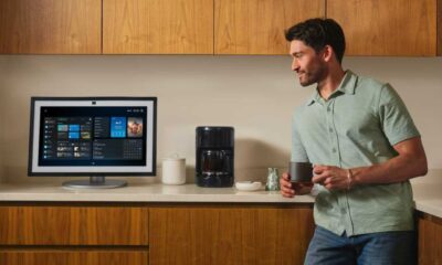 Alexa+ on a screen with a man standing next to it