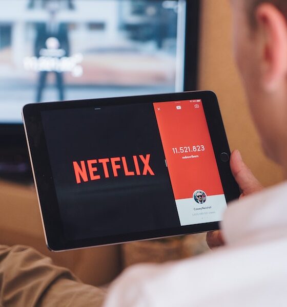 Man watching Netflix using an iPad