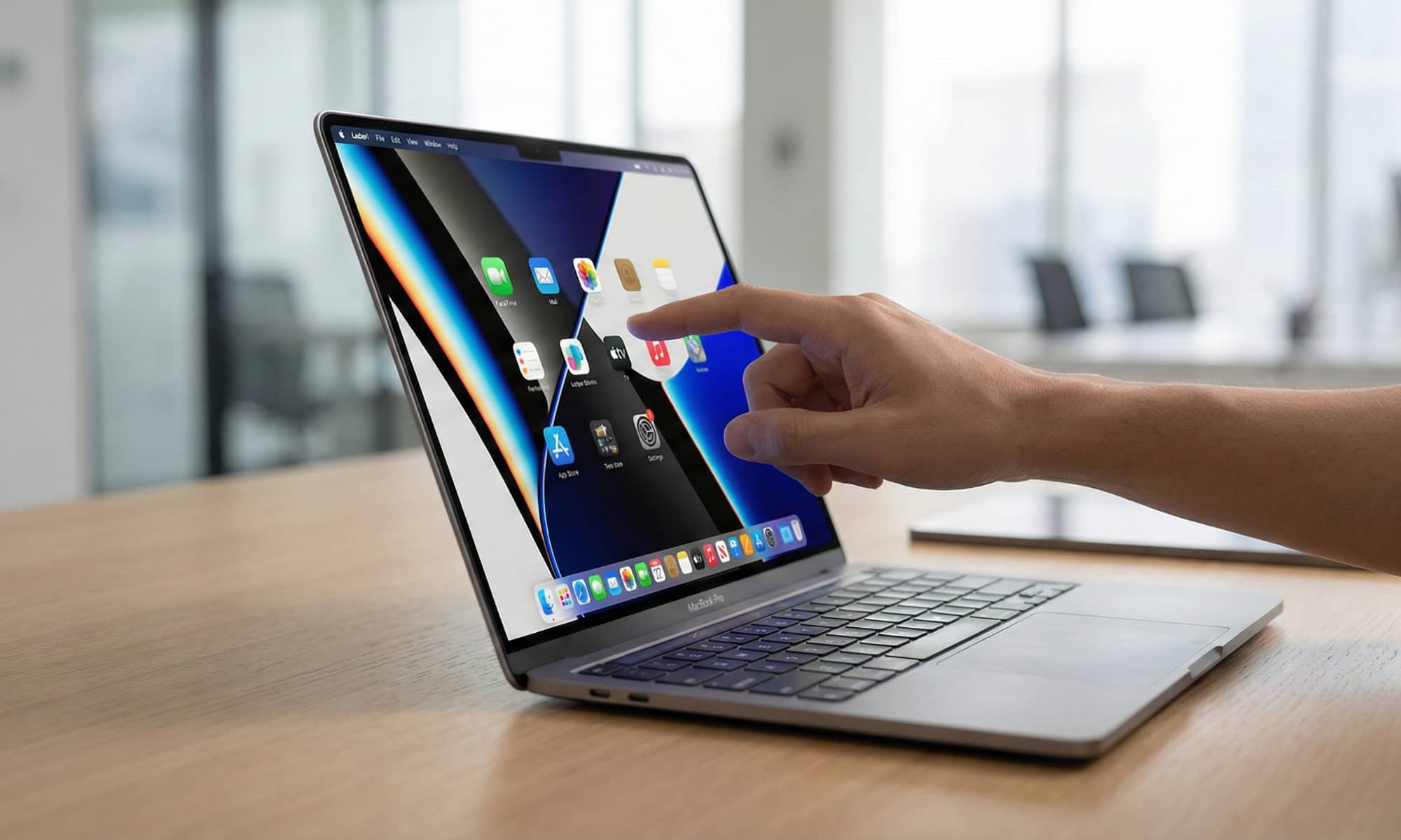 A close-up lifestyle concept shot of a person’s hand using touch gestures on the ultra-slim OLED display of a 2026 MacBook Pro in a bright, modern office setting.