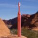 Suri 2.0 Canyon Sunrise electric toothbrush standing on a rock