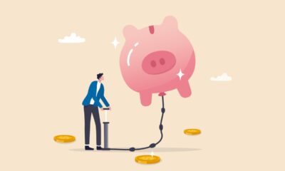 pumping air into a floating piggy bank