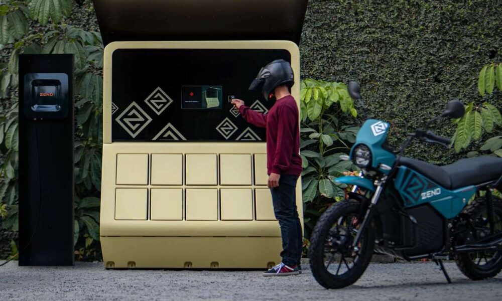 A man swaps batteries for an electric motorbike.