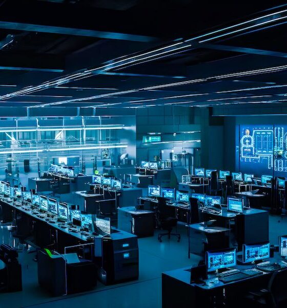 The inside of an office with computers and monitors. Generative AI.