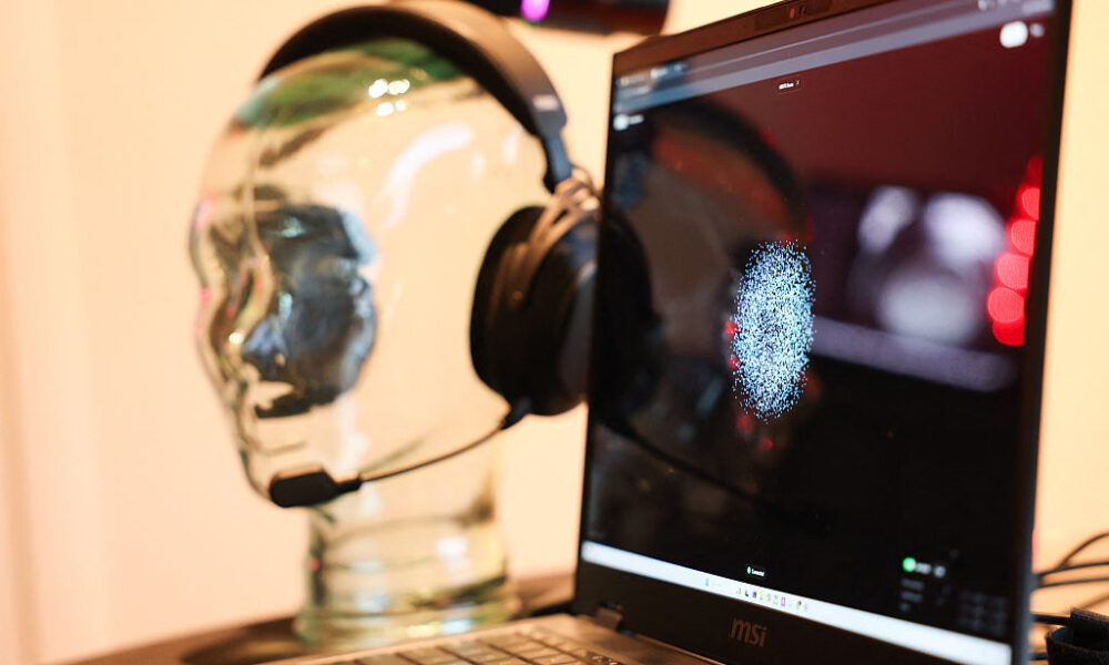 A representation of brain focus as a pattern of dots is displayed by the Prime application as the Neurable and HP Inc.'s HyperX collaboration brain-computer interface and gaming audio headset is demonstrated for neurofeedback to measure brainwave activity (EEG) and improve brain function.