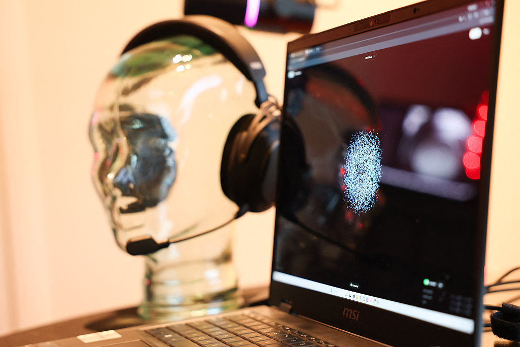 A representation of brain focus as a pattern of dots is displayed by the Prime application as the Neurable and HP Inc.'s HyperX collaboration brain-computer interface and gaming audio headset is demonstrated for neurofeedback to measure brainwave activity (EEG) and improve brain function.