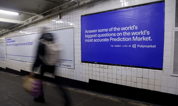 A Polymarket advertisement in a subway station in New York, US, on Thursday, Feb. 5, 2026. Kalshi and Polymarket, which have been assailed by critics for encouraging financial risk taking by making betting more accessible, are now using the promise of free groceries to win over New Yorkers.