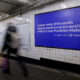 A Polymarket advertisement in a subway station in New York, US, on Thursday, Feb. 5, 2026. Kalshi and Polymarket, which have been assailed by critics for encouraging financial risk taking by making betting more accessible, are now using the promise of free groceries to win over New Yorkers.