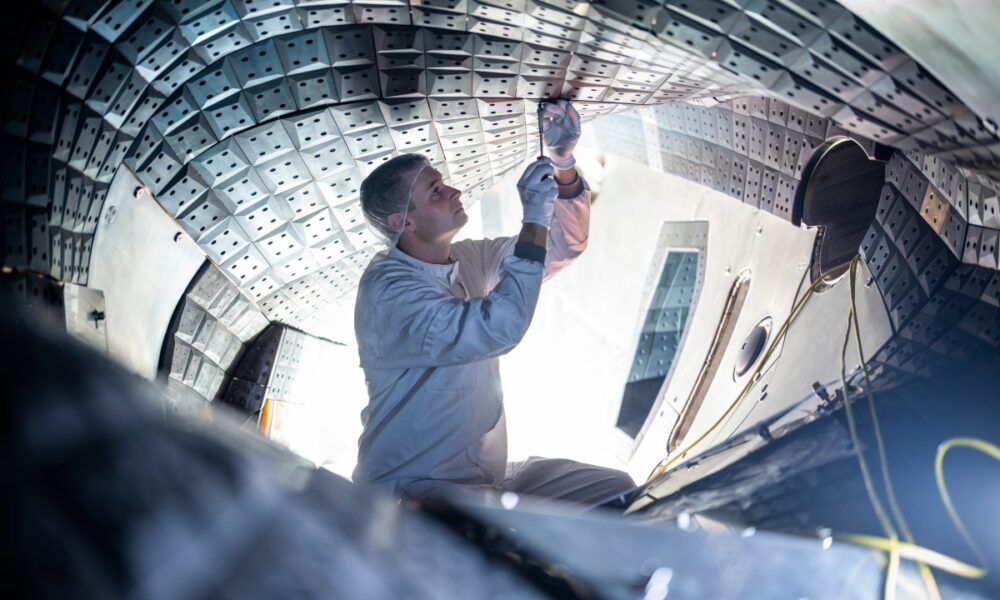 Engineer working on Wendelstein 7-X stellarator.