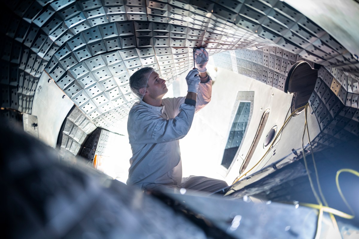 Engineer working on Wendelstein 7-X stellarator.