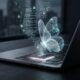 A MacBook Pro sits on a desk in a dark room with a glowing M5 chip and a holographic butterfly representing Anthropic's Project Glasswing AI.