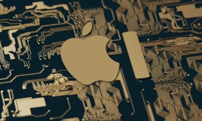 Apple AI logo on dark gold circuitboard
