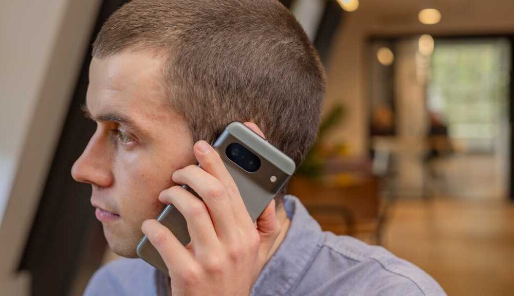 A man using the Google Pixel 8 smartphone