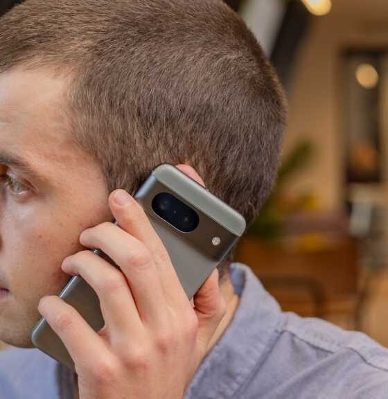 A man using the Google Pixel 8 smartphone