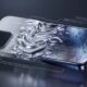 A conceptual 3D render showing an abstract iPhone frame transitioning from aluminum into a swirling liquid metal on one side and an advanced titanium alloy on the other, symbolizing Apple's search for new materials.