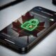 A dramatic, low-key photograph of an iPhone 17 Pro on a brushed titanium surface, displaying the 'Data Protection is Enabled' setting. A subtle, glowing red maple leaf and a green digital padlock icon are overlaid, visually representing the conflict between Canadian legislation and Apple's encryption.