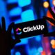 ClickUp logo on a smartphone
