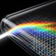 A conceptual close-up conceptual abstract image showing light refracting and dispersing into a rainbow spectrum as it enters the complex quad-curved glass corner of a futuristic display, visualizing potential edge distortion.