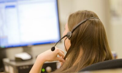 A photo of a call center representative taken from behind, used in a post about Operative Intelligence