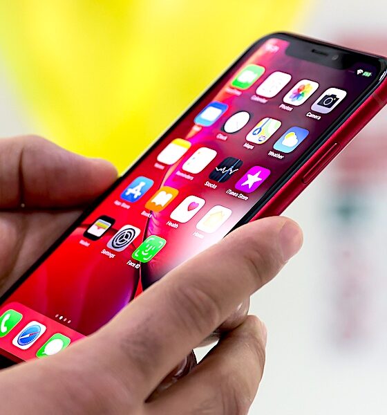 Holding Using Iphone Xr Red In Hands