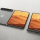 Concept image of a passport-style "iPhone Fold" laying flat on a gray table.
