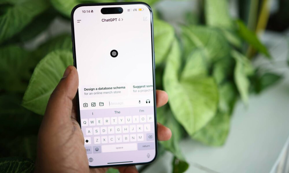 person holding iphone chatgpt app