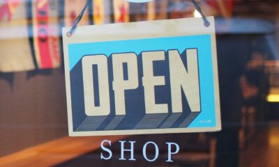 Open shop sign in a store as SAP and Google Cloud are deploying agentic commerce architecture to automate multi-agent marketing and retail operations at enterprise scale.