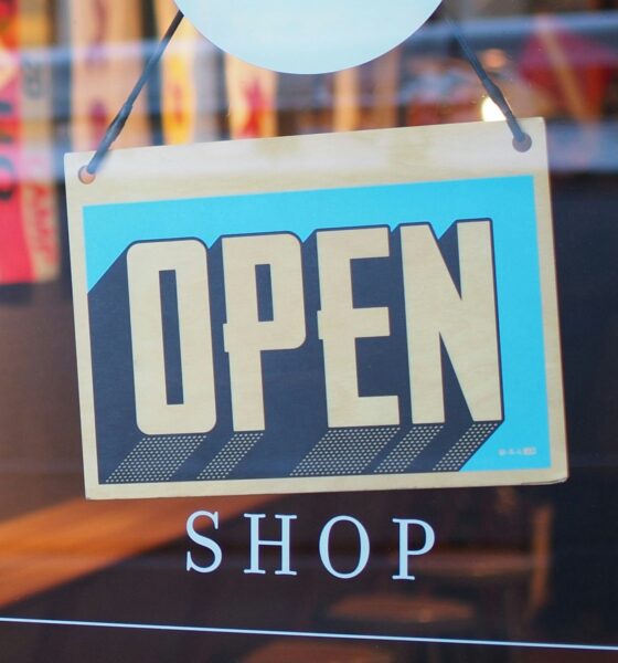 Open shop sign in a store as SAP and Google Cloud are deploying agentic commerce architecture to automate multi-agent marketing and retail operations at enterprise scale.