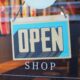 Open shop sign in a store as SAP and Google Cloud are deploying agentic commerce architecture to automate multi-agent marketing and retail operations at enterprise scale.