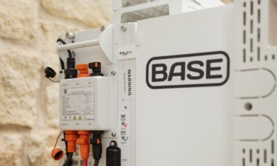 A Base Power battery sits next to a home.