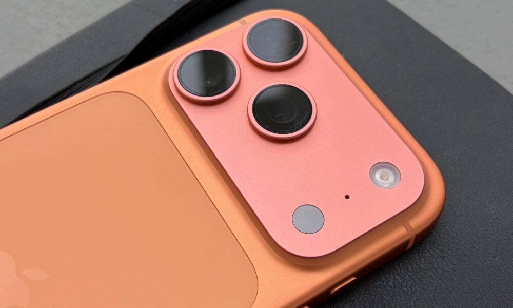 Detailed close-up of the triple-lens camera array on the back of an iPhone 17 Pro.