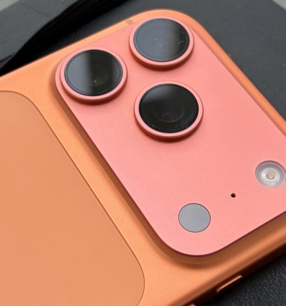 Detailed close-up of the triple-lens camera array on the back of an iPhone 17 Pro.