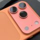 Detailed close-up of the triple-lens camera array on the back of an iPhone 17 Pro.