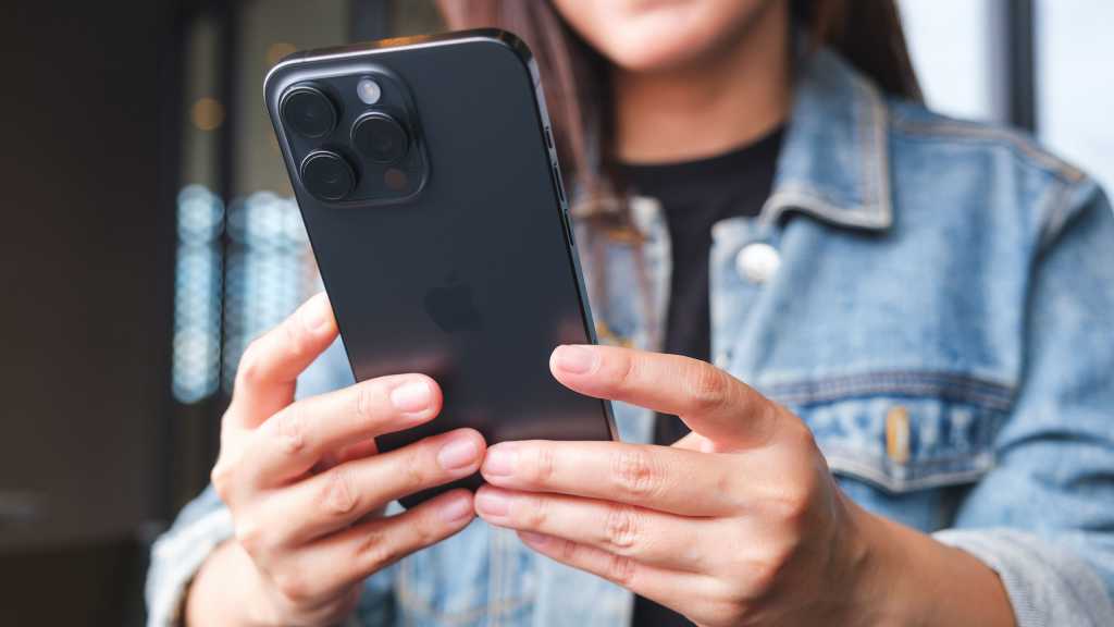 Woman with smartphone in hands, iPhone