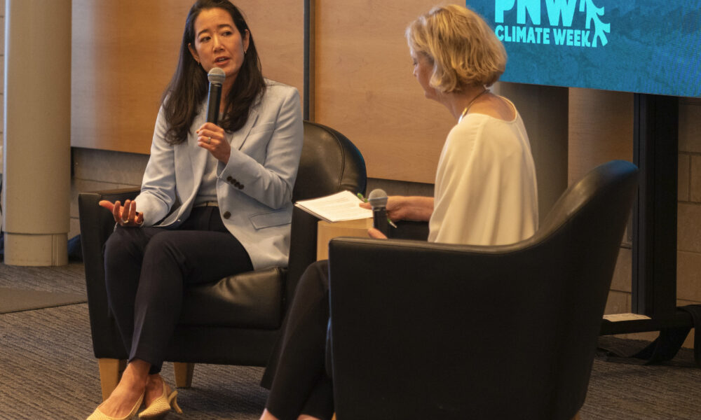 Protesters confront Microsoft CSO over carbon goals and AI, disrupting climate event – GeekWire