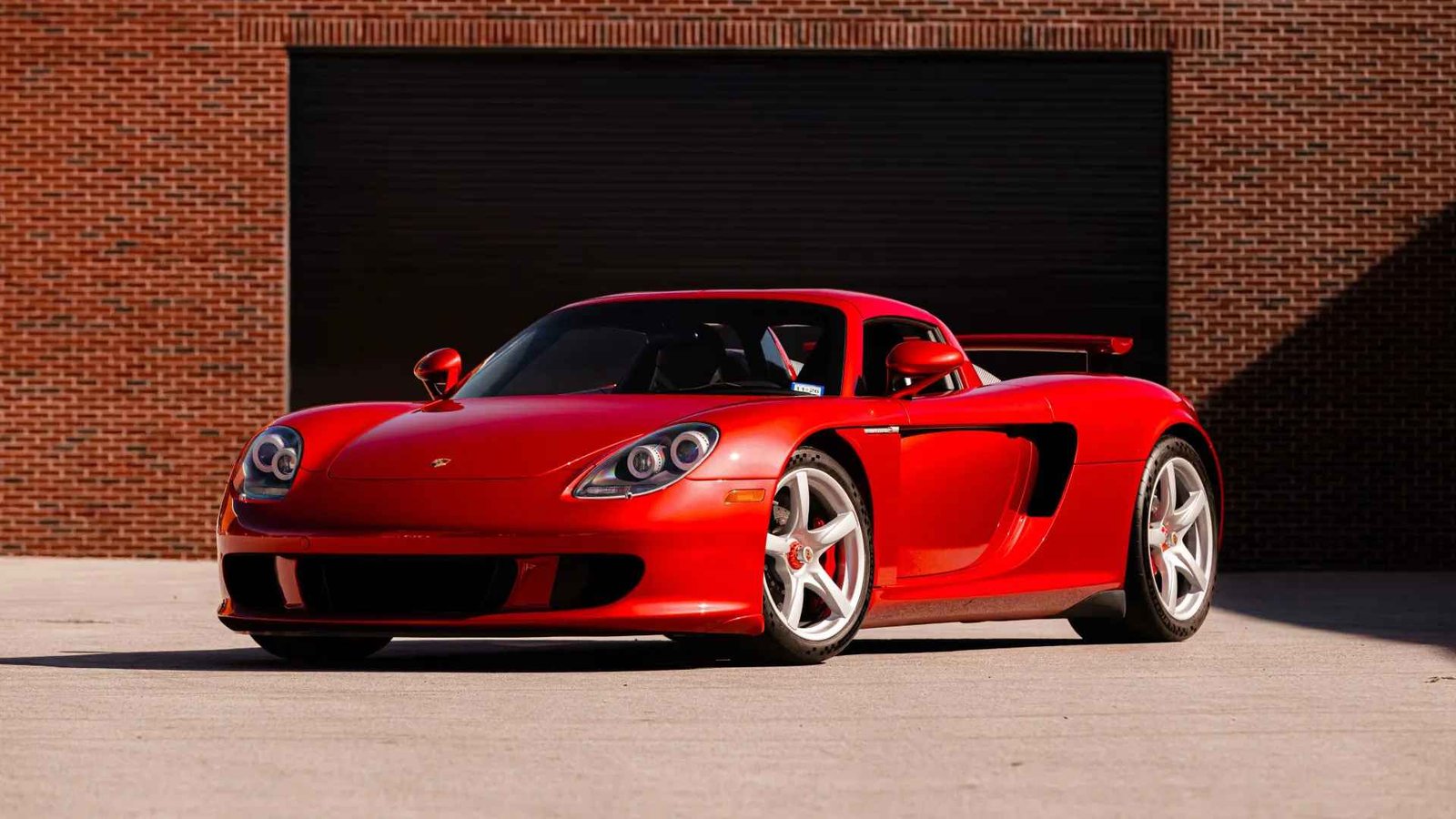 Manual Porsche Carrera GT in Ferrari Rosso Fuoco heads to auction in US